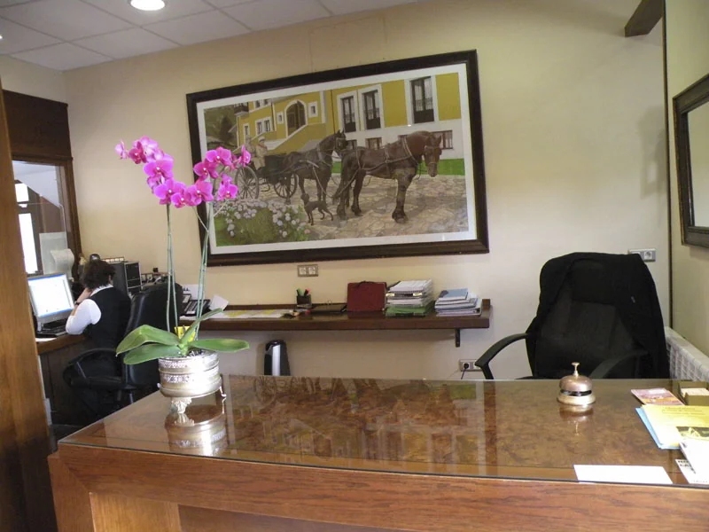 Reception desk with a pink orchid